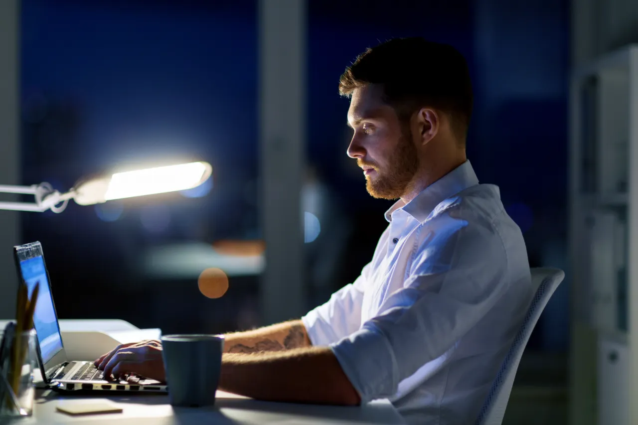 business-overwork-deadline-people-concept-man-with-laptop-coffee-working-late-night-office